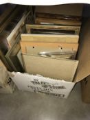 A box of pictures and picture frames