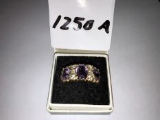 A 9ct gold ring set amethysts.