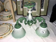 A collection of glass lamp shades including antique etched shade along with funnels and 3 branch
