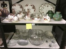 2 shelves of various china and glassware including a 35 piece tea set,