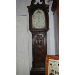 A carved oak Grandfather clock.