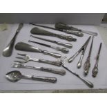 14 silver handled items including glove stretchers, button hooks, shoe horns, pickle fork etc.