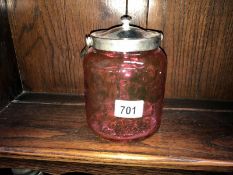 A cranberry glass biscuit barrel with EPNS lid & handle