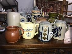 A small collection of stoneware jugs & steins