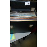 A box of LP records including Rolling Stones, David Bowie, John Lennon, Motown etc.