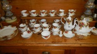 Approximately 58 pieces of Royal Albert Old Country Roses tea and dinnerware.