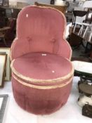 A pink upholstered bedroom chair