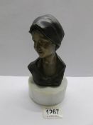 An Italian bronze bust of a lady on circular plinth, inscribed B M Milano.