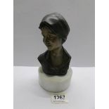 An Italian bronze bust of a lady on circular plinth, inscribed B M Milano.