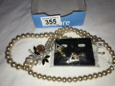 A faux pearl necklace with jewelled embellishment