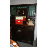 A Edwardian sideboard with green bubble glass decoration.