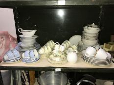 A shelf of 3 part tea/dinner sets