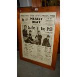 A large framed and glazed Beatles poster.