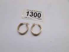 A pair of 9ct gold earrings, approximately 3 grams.