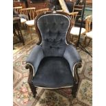 A Victorian button backed arm chair.