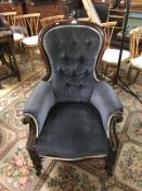 A Victorian button backed arm chair.