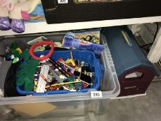 A box of children's construction kits mainly Knex but there is a small amount of Lego & a toy barn