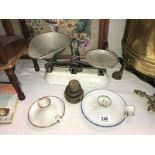 A set of scales & weights & 2 chamber candlesticks