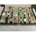 A watch case containing 23 modern wrist watches.