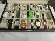 A watch case containing 23 modern wrist watches.