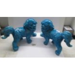A pair of Chinese blue pottery 'Dogs of Foo'.