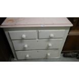 An old painted 2 over 2 chest of drawers.