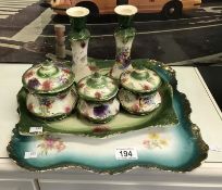 A nice porcelain dressing table set including 2 trays, 2 candlesticks etc.