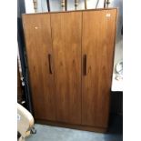 A large teak wardrobe