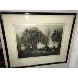 A framed & glazed engraving of dancers in a forest, signed but indestinct.