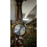 A mahogany barometer.