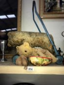 A vintage push-a-long bear on wheels and 3 other vintage bears