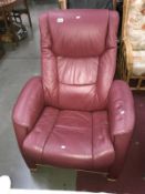 A red leather reclining armchair