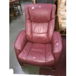 A red leather reclining armchair