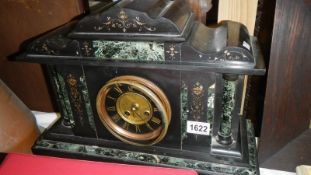 A Victorian black Palladian style mantel clock.