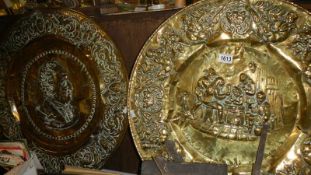 A large pair of brass wall plaques. and a copper tray.