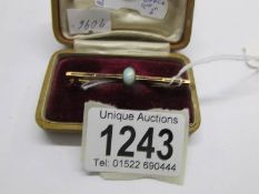 A 9ct gold bar brooch set opal.
