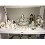 A shelf of porcelain ornaments, bowls, cups & vases etc.