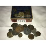 A collection of old coins including Roman, British and world.