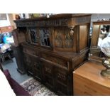 A Gothic style carved wood buffet