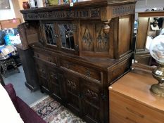 A Gothic style carved wood buffet