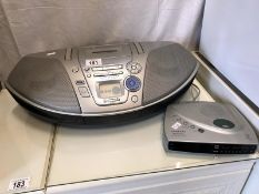 A Panasonic portable CD/tape deck and a Roberts clock radio