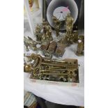 A mixed lot of brassware including figures, key's, miniature Miner's lamps. taps etc.