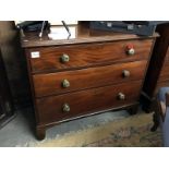 A Victorian mahogany chest of drawers with brass handles