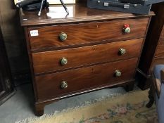 A Victorian mahogany chest of drawers with brass handles