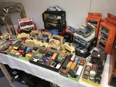 A collection of boxed & unboxed diecast cars