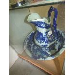 A blue and white jug and basin set.