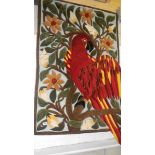 A wool wall hanging/rug featuring a parrot.