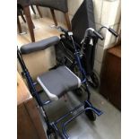 A folding wheelchair and a mobility "shopper" chair