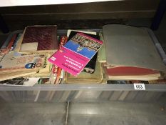 A box of assorted books & maps