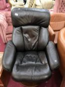 A black leather rotating executives chair